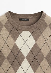 Crew neck sweater with brown and beige argyle diamond pattern and Massimo Dutti label at the collar, displayed on a white background.