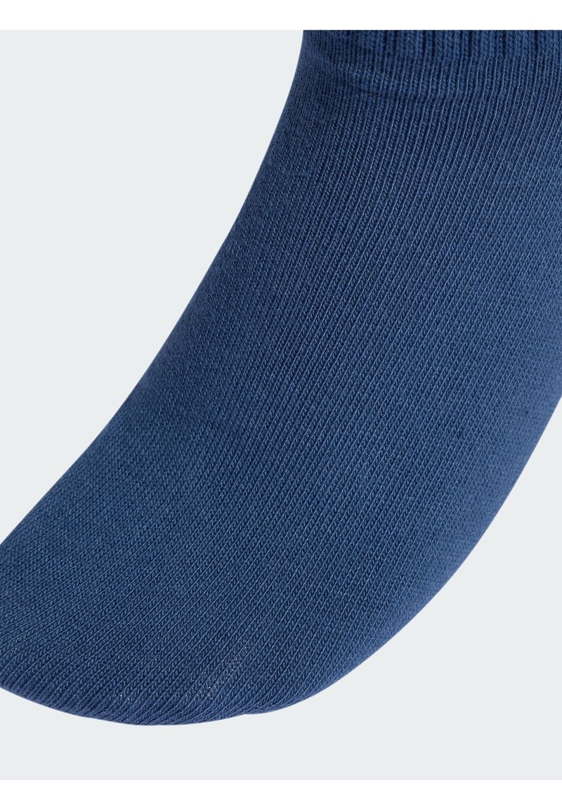 Marineblaue Socke mit glatter Textur, ausgestattet mit einem gerippten Bündchen und nahtlosem Zehenbereich, aus leichtem und dehnbarem Material.