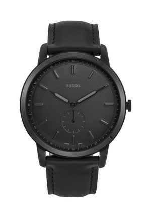 Schwarze analoge Fossil-Armbanduhr mit Lederarmband, minimalistischem Zifferblatt und kleinem Sekunden-Unterzifferblatt, das die Zeit 10:10:30 anzeigt.