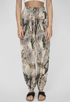 Lightweight, airy pants with a palm leaf print in beige, black, and green. Featuring an elastic waistband and gathered cuffs.