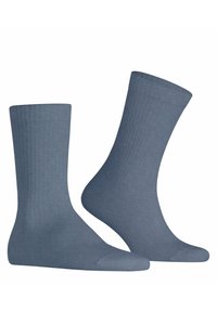 Calze di cotone blu con texture a coste, altezza media e design della punta senza cuciture. Finitura liscia, senza motivi o decorazioni.