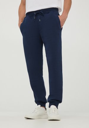 - Spodnie treningowe