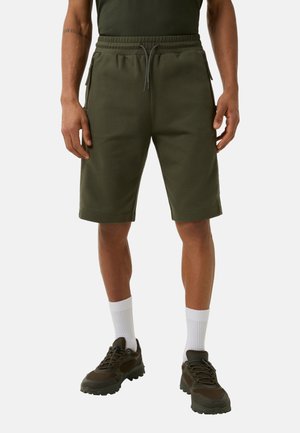 Olive green shorts made of soft fabric, featuring an elastic waistband with drawstring, side pockets, and a knee-length design.