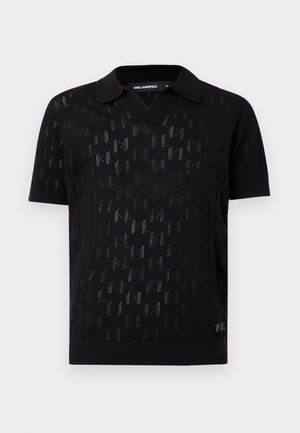 Black short-sleeve polo shirt with textured knit pattern and small logo near hem, featuring pointed collar and medium size tag.