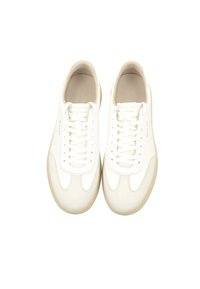 White leather sneakers featuring a smooth upper, round toe, flat laces, and a light tan rubber sole with subtle raised detailing.