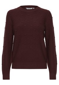 Bordeaux gestrickter Pullover mit Rundhalsausschnitt, der durchgehend mit strukturierten erhabenen Punkten verziert ist, sowie mit gerippten Bündchen und Saum. Kleines Logo an der Seite.