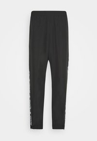 TAPE TRACKPANTS - Pantalon de survêtement - black