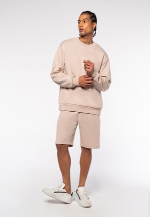 UNISEX  RELAXED FIT - Jogginghose - beige