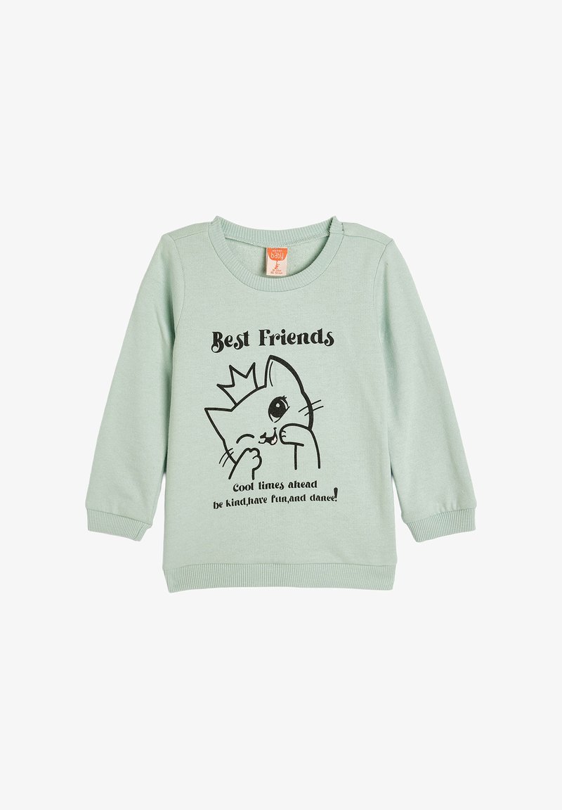 Sudadera de color verde menta con una ilustración de un gato de dibujos animados negro, texto "Mejores Amigos" y puños y cuello de canalé.