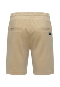 Beige shorts made from textured fabric, featuring an elastic waistband and two rear pockets. Includes a small brand label on the back.