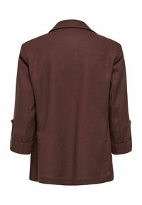 Blazer marron à manches longues avec col, coutures visibles et poignets retroussés, vu de dos sur fond blanc.