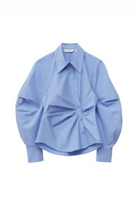 Light blue button-up shirt with a structured collar, puffed sleeves, and gathered fabric detail on the front. Made of smooth cotton material.