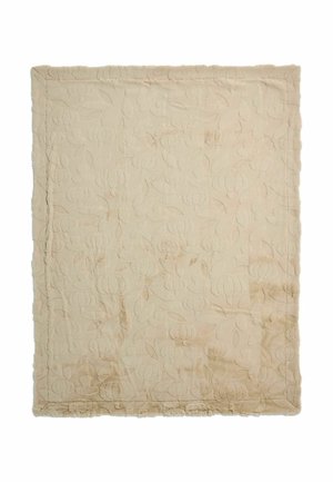 Beige rektangulært quilt med præget græskar- og bladmotiv og syede kanter.