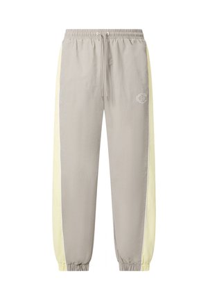 Ανοιχτό γκρι παντελόνι jogging με απαλές κίτρινες λωρίδες στα πλάγια, ελαστικά τελειώματα στα μπατζάκια και στη μέση, κορδόνια και μικρό λογότυπο στο αριστερό μπούτι.