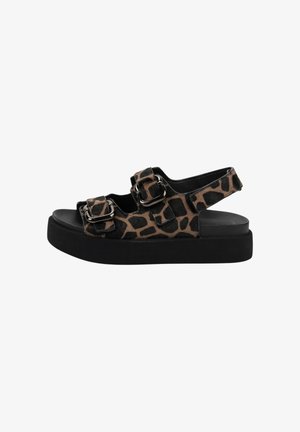 Platform sandal with black sole, leopard-print straps, and two adjustable metal buckles on top and one around the heel.