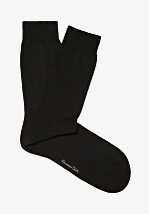 Chaussettes en coton noir avec des côtes, présentant une texture lisse et une étiquette "Massimo Dutti" brodée en blanc près de la zone des orteils.