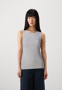 Gray sleeveless ribbed tank top with a round neckline, fitted silhouette, and smooth texture, paired with dark trousers.