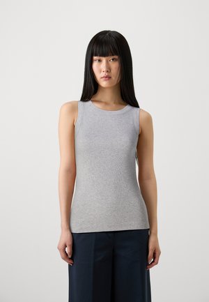 Gray sleeveless ribbed tank top with a round neckline, fitted silhouette, and smooth texture, paired with dark trousers.