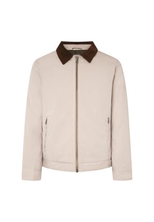 La chaqueta beige presenta un collar de pana marrón, cierre frontal con cremallera y dos bolsillos laterales; tejido suave con un diseño de corte recto.