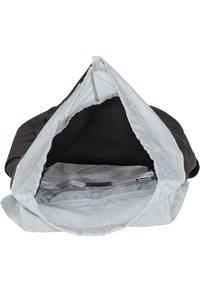 Black bag with a smooth interior lining. Opens wide with a zipper closure, featuring an internal zip pocket and branded tag.