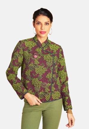 Colorful jacket with a floral pattern in green and purple, made of textured fabric, featuring a high neckline and contrasting black accents.