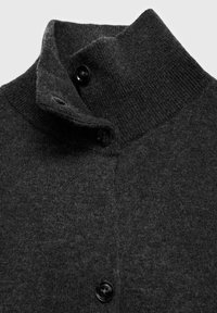 Dark gray knit cardigan featuring a high collar, three black buttons, and a soft texture. The fabric shows a slight heathered pattern.