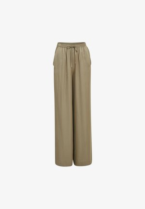 Pantalons larges beiges en tissu doux. Dotés d'une taille élastique avec cordon de serrage et de poches latérales pour plus de fonctionnalité.