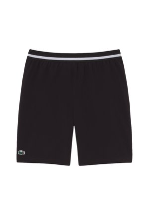 Pantalones cortos deportivos negros con una cintura elástica blanca y negra y un pequeño logotipo de cocodrilo verde en el dobladillo de la pierna izquierda.