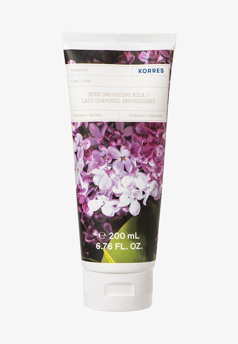 Korres Body Smoothing Milk, lila-thema tube met bloemenontwerp, witte flip-top dop, 200 mL, bevat producttekst in meerdere talen.