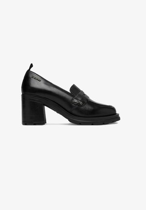 Schwarzer Damenloafer aus Leder mit Blockabsatz, dekorativem Riemen und geprägt eingraviertem G-Star Logo an der Ferseninnenseite.