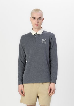 Dugmad s dugim rukavima u tamnosivoj boji od pamuka s kragnom u boji krem i izvezenim logom "H" na lijevoj strani grudnog koša. Jednostavan dizajn, opušteni fit.