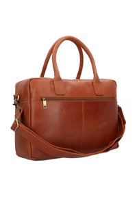Bruine leren tas met twee bovenhandvatten en een afneembare schouderriem. Voorzien van een vo zipper vak en een gladde, textuurachtige afwerking.