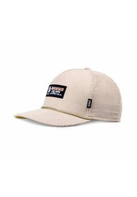 Beige corduroy baseball cap with a black logo patch, green accent on the brim, and a small branding tag on the side.