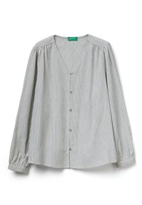 Camicia a righe con bottoni in tessuto leggero. Collo a V, maniche lunghe con polsini arricciati, caratterizzata da righe verticali bianche e nere.