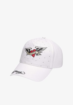 White cap featuring embroidered red heart with wings and a “LOVE” banner. Clear rhinestones embellish the surface; curved visor.