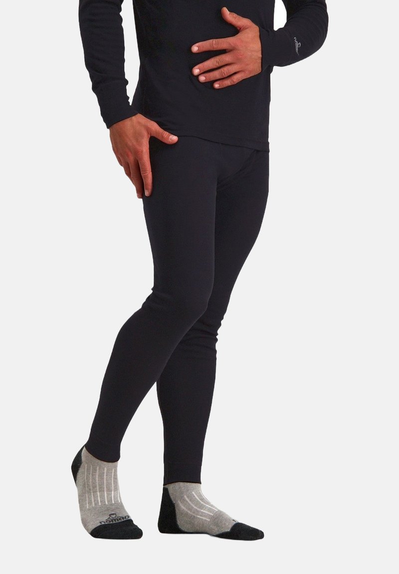 Zwarte lange mouwen top gecombineerd met zwarte leggings en grijs gestreepte enkelkousen. De stof ziet er glad en aansluitend uit.