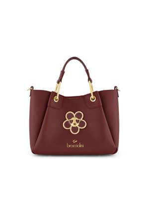 Borsa marrone con manici dorati e un emblema dorato a forma di fiore con occhi a forma di cuore sulla parte anteriore, di marca "Tua Braccialini."