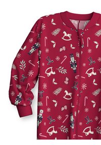 Tutina rossa in tessuto con vari motivi a tema festivo, tra cui soldatini, bastoncini di zucchero, fiocchi di neve e cavallucci a dondolo. Presenta una chiusura a zip.
