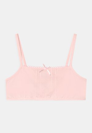 Bralette de algodão rosa com alças ajustáveis, uma textura suave e um laço decorativo ao centro. Apresenta um design simples.