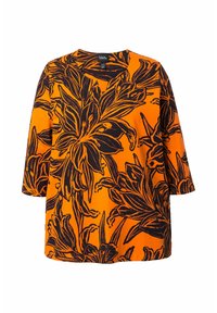 Orange Bluse mit V-Ausschnitt, die mit einem kräftigen schwarzen Blumenmuster versehen ist. Aus glattem Stoff gefertigt, mit 3/4-Längenärmeln und einer lässigen Passform.