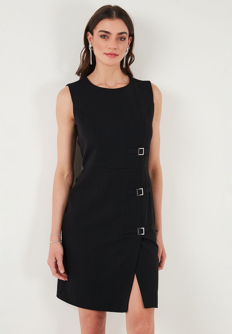 Black sleeveless dress featuring a fitted silhouette, side slit, and three rectangular silver buckle accents on the waist. Smooth fabric texture.