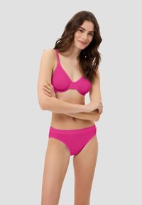 Pink bra and matching bikini briefs made of smooth fabric; bra features adjustable straps and a seamless design for comfort.