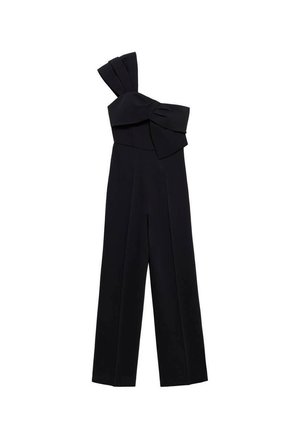 Tuta nera con design a una spalla, caratterizzata da un ampio fiocco decorativo. Realizzata in tessuto liscio, con gambe larghe e una vestibilità su misura.