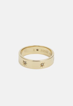 Gold-tone metal ring featuring a smooth band with starburst designs and small embedded crystals, size 8, engraved with "FOSSIL."