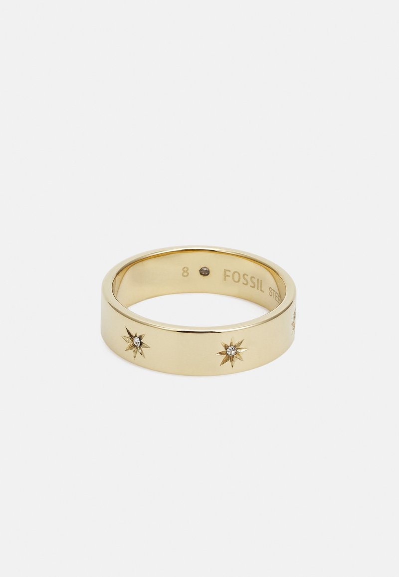 Bague en métal doré avec un bandeau lisse agrémenté de motifs d'éclat d'étoile et de petits cristaux intégrés, taille 8, gravée "FOSSIL".