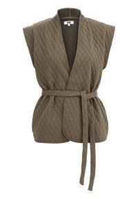 Oliveenvihreä tikkiliivi, jossa on V-aukko ja leveät hihat. Vyötäröllä on vyö ja koko liivin läpi kulkee teksturoitu timanttikuosi.