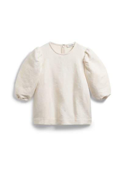 Blusa color crema con tessuto testurizzato, scollatura rotonda e maniche a sbuffo. Presenta una chiusura con zip sul retro per una facile vestibilità.