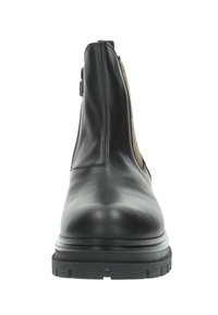 Botín Chelsea de cuero negro con paneles laterales elásticos, punta redondeada y suela de goma texturizada. Acabado suave con detalles de costura en las costuras.