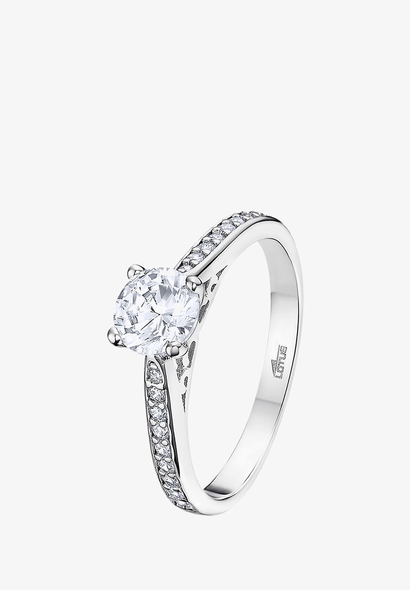 Round diamond engagement ring with silver band, featuring a crown setting and small side stones along the shank for added detail.