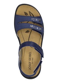 Merenpohjainen sandaali kahdella säädettävällä hihnalla, koristeelliset kimalteet ja pehmustettu pohjalevy, jossa on lehtikuvio. Kumipohja.